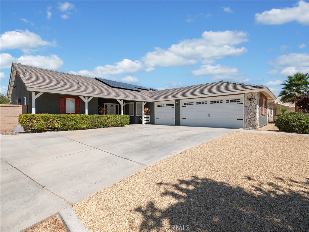 12949 Choco Road Apple Valley, CA 92308 - Photo 1 of 48 a view of large house with a street