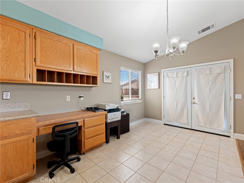 12949 Choco Road Apple Valley, CA 92308 - Photo 18 of 48 a view of a kitchen with workspace and windows