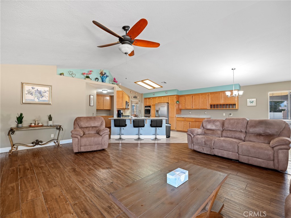 12949 Choco Road Apple Valley, CA 92308 - Photo 23 of 48 a living room with furniture and a couch