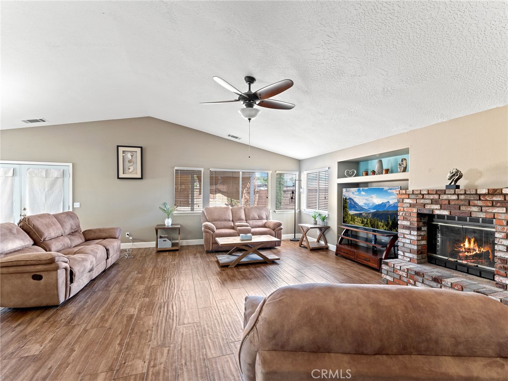 12949 Choco Road Apple Valley, CA 92308 - Photo 24 of 48 a living room with furniture and a fireplace
