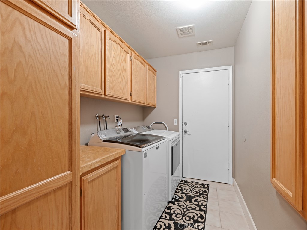 12949 Choco Road Apple Valley, CA 92308 - Photo 26 of 48 a kitchen with a sink and cabinets