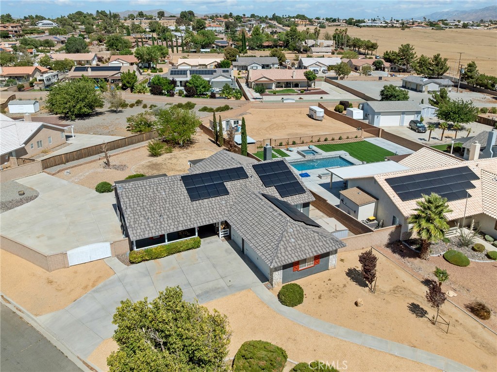 12949 Choco Road Apple Valley, CA 92308 - Photo 39 of 48 an aerial view of a house with a swimming pool