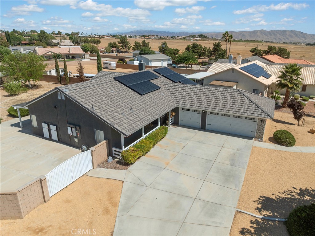 12949 Choco Road Apple Valley, CA 92308 - Photo 45 of 48 an aerial view of a house with a terrace