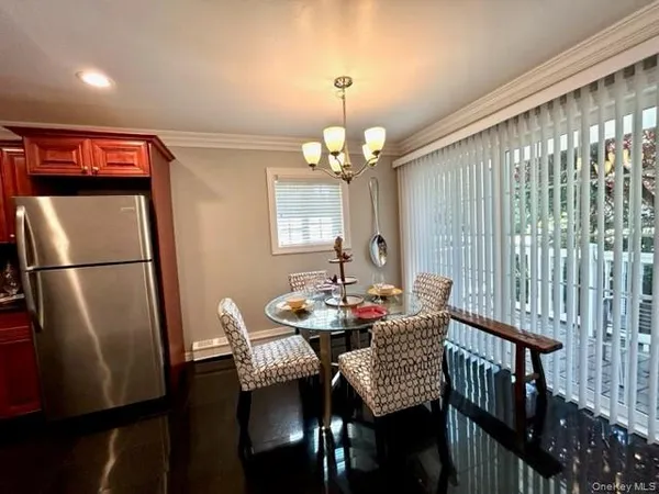 a view of a dining room with furniture window and outside view
