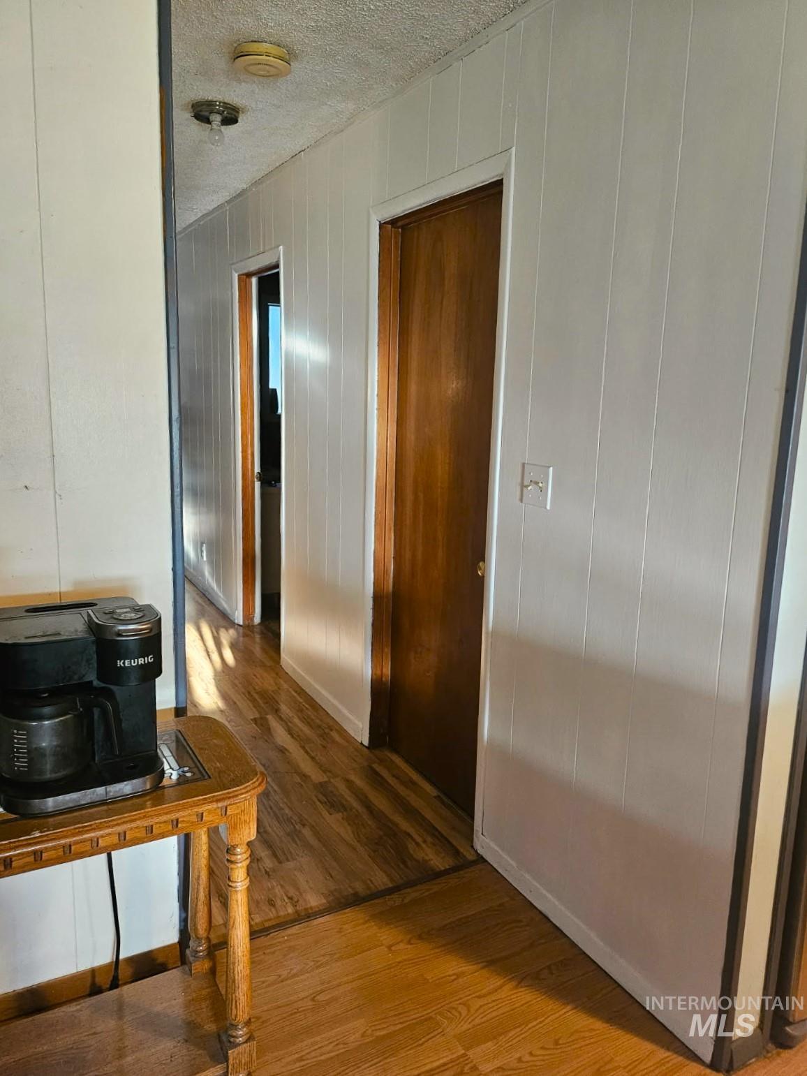 3756 Farrell Road New Meadows, ID 83654 - Photo 17 of 50 Hall featuring wood finished floors, a textured ceiling, and wooden walls