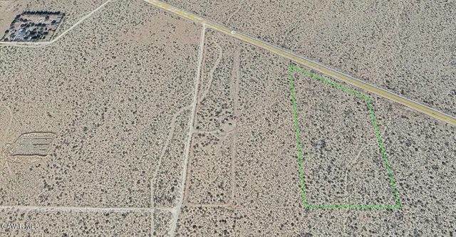 a close up of a white marble wall with a shower