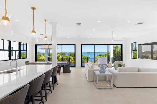 a room with lots of furniture and a large window