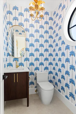 a bathroom with a toilet and a sink