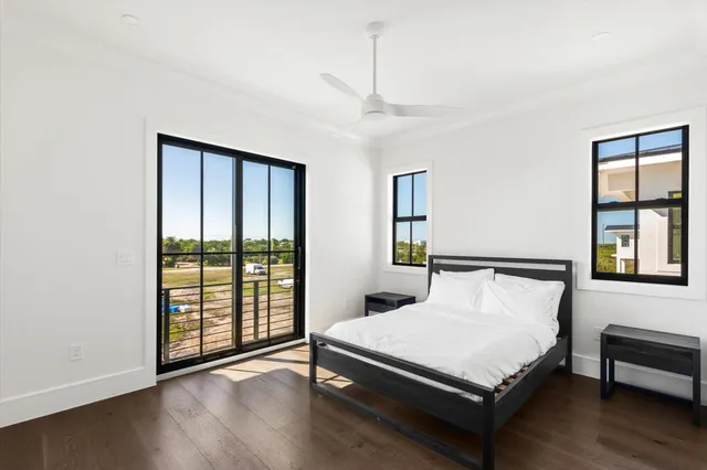 a bathroom with a toilet sink vanity and shower