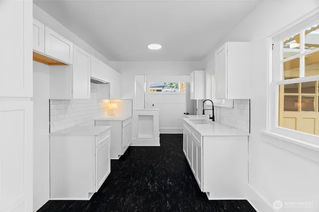 a view of a patio with couches and a dining table and chairs with outer view