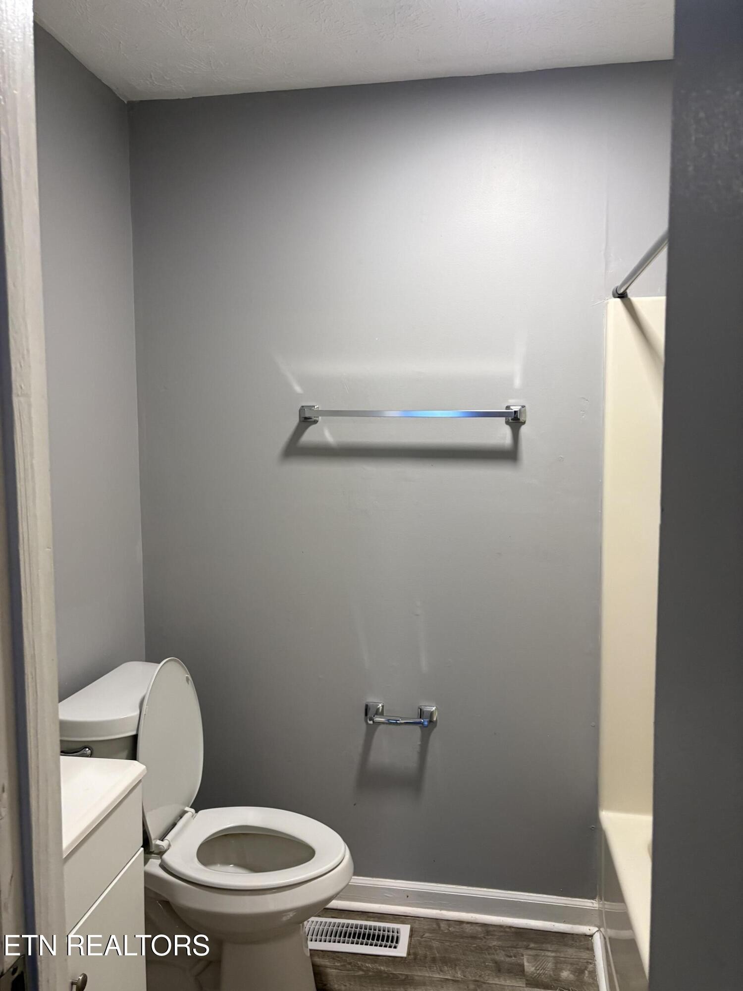 123 Tub Springs Road, Unit 3 Harriman, TN 37748 - Photo 9 of 11 a white toilet sitting next to a shower