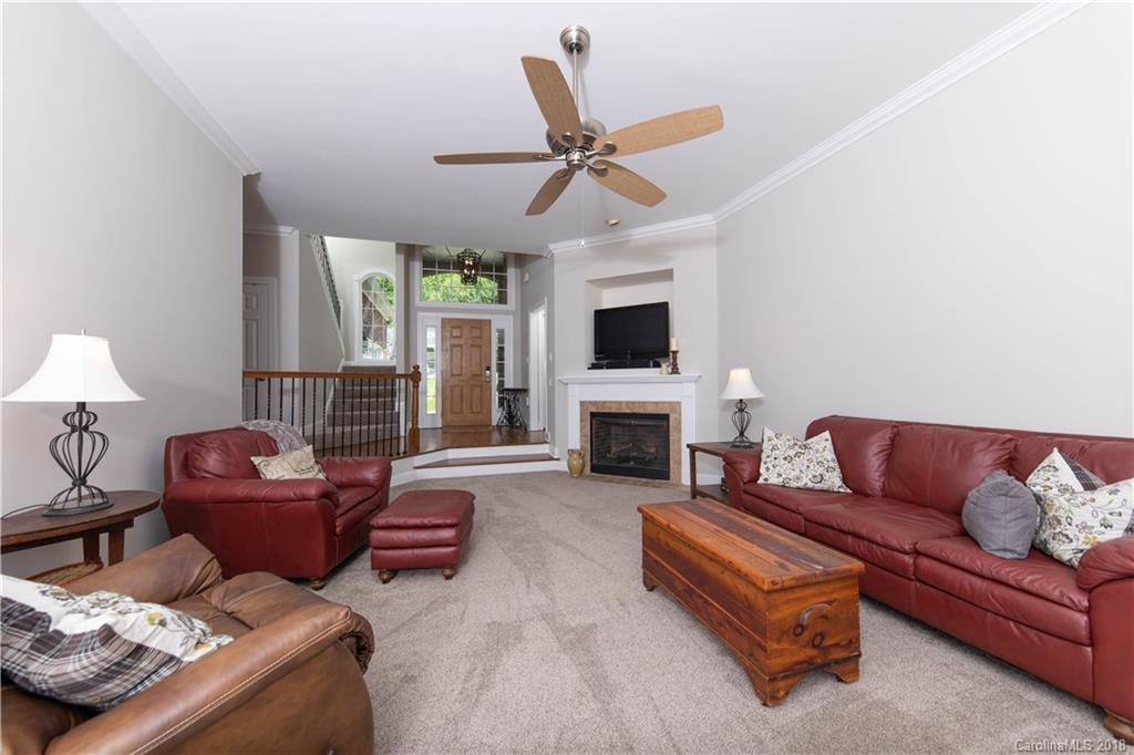 1334 Crown Ridge Drive Fort Mill, SC 29708 - Photo 2 of 25 a living room with furniture and a fireplace