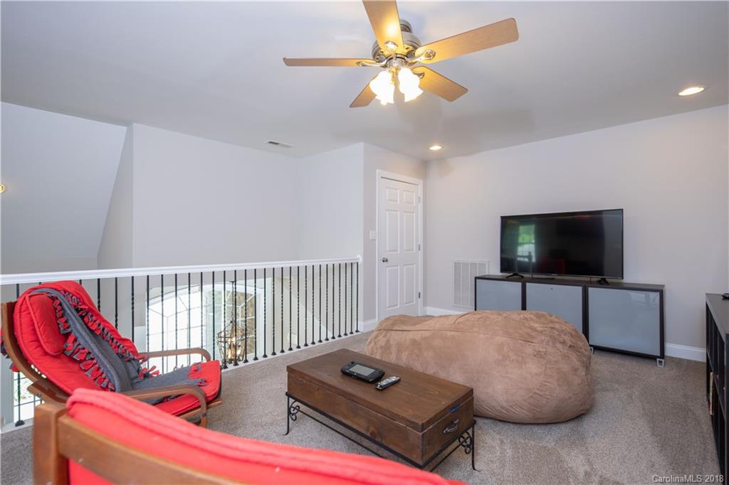 1334 Crown Ridge Drive Fort Mill, SC 29708 - Photo 16 of 25 a living room with furniture and a flat screen tv