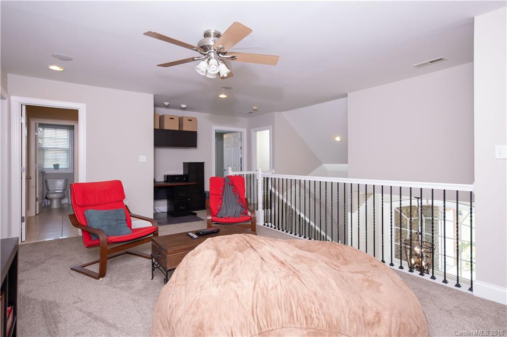 1334 Crown Ridge Drive Fort Mill, SC 29708 - Photo 17 of 25 a view of a workspace with furniture and a chandelier
