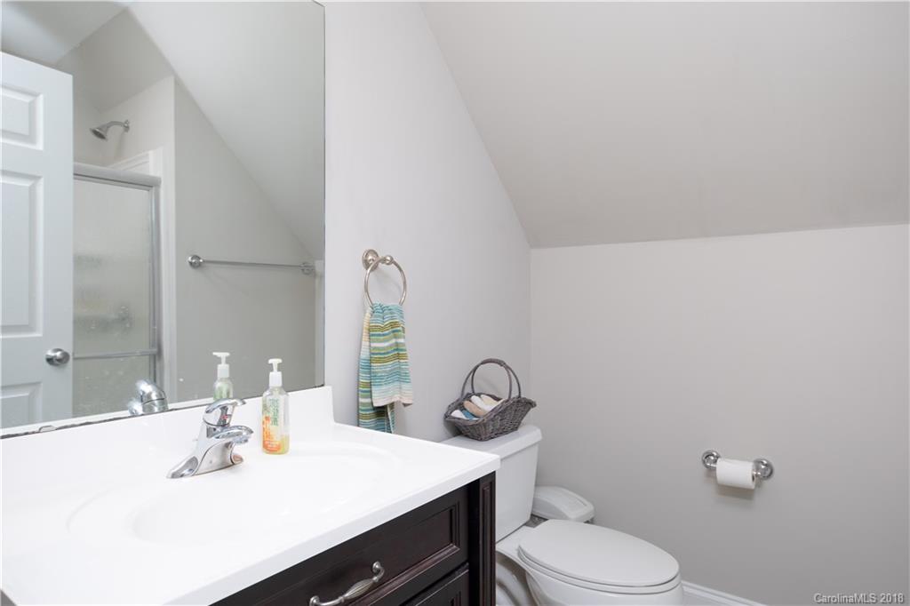 1334 Crown Ridge Drive Fort Mill, SC 29708 - Photo 19 of 25 a bathroom with a sink vanity mirror and toilet