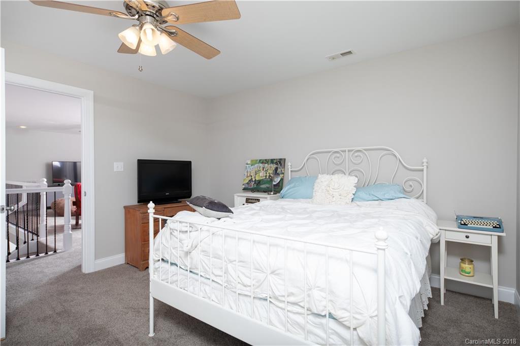 1334 Crown Ridge Drive Fort Mill, SC 29708 - Photo 20 of 25 a bedroom with a bed and a tv
