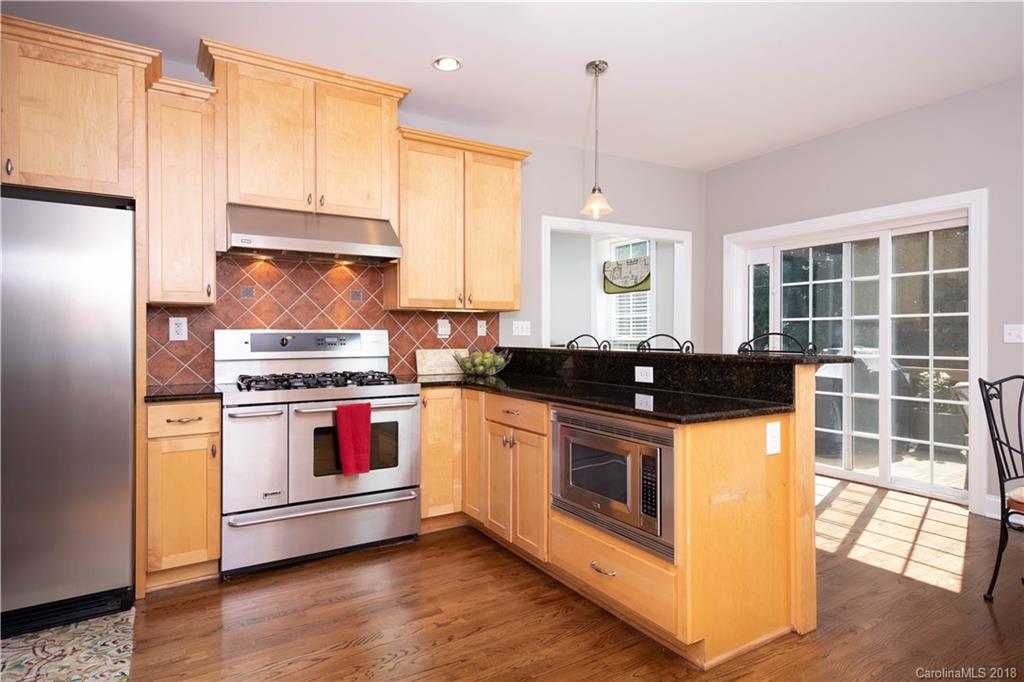 1334 Crown Ridge Drive Fort Mill, SC 29708 - Photo 7 of 25 a kitchen with granite countertop a stove and a sink