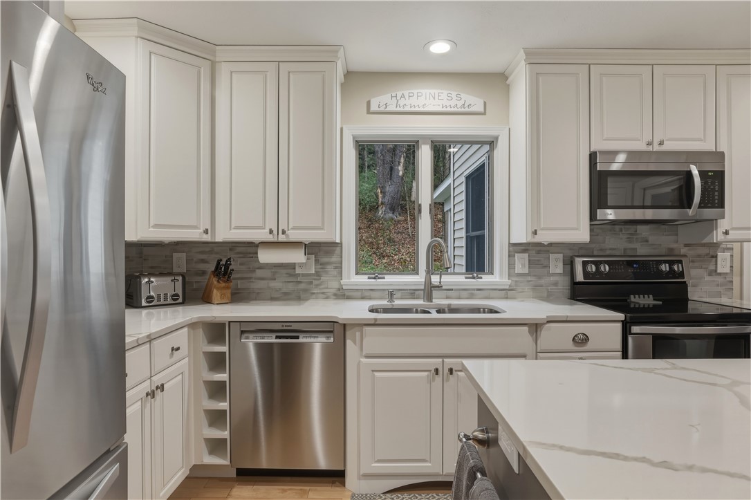 2304 Whiskey Creek Road Corning, NY 14830 - Photo 12 of 42 Check out the reconditioned cabinets. They look j
