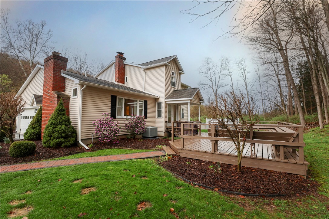 2304 Whiskey Creek Road Corning, NY 14830 - Photo 2 of 42 The rear view shows you the expansive deck with bu