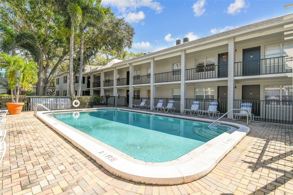 5221 Bayshore Boulevard, Unit 21 Tampa, FL 33611 - Photo 16 of 21 a view of a swimming pool with a patio