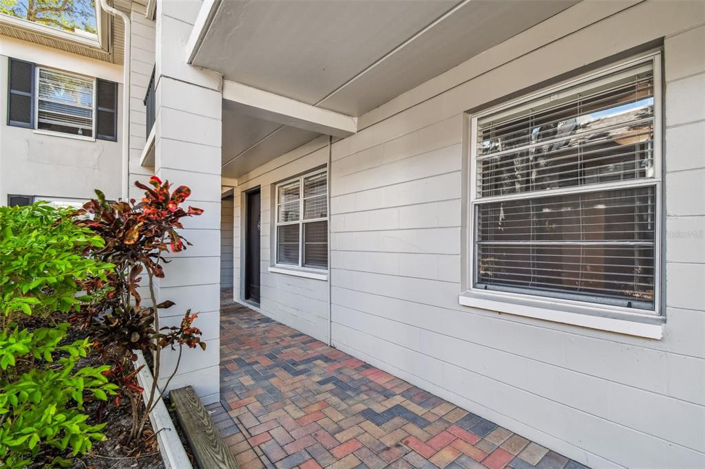 5221 Bayshore Boulevard, Unit 21 Tampa, FL 33611 - Photo 18 of 21 a view of a porch with a bench