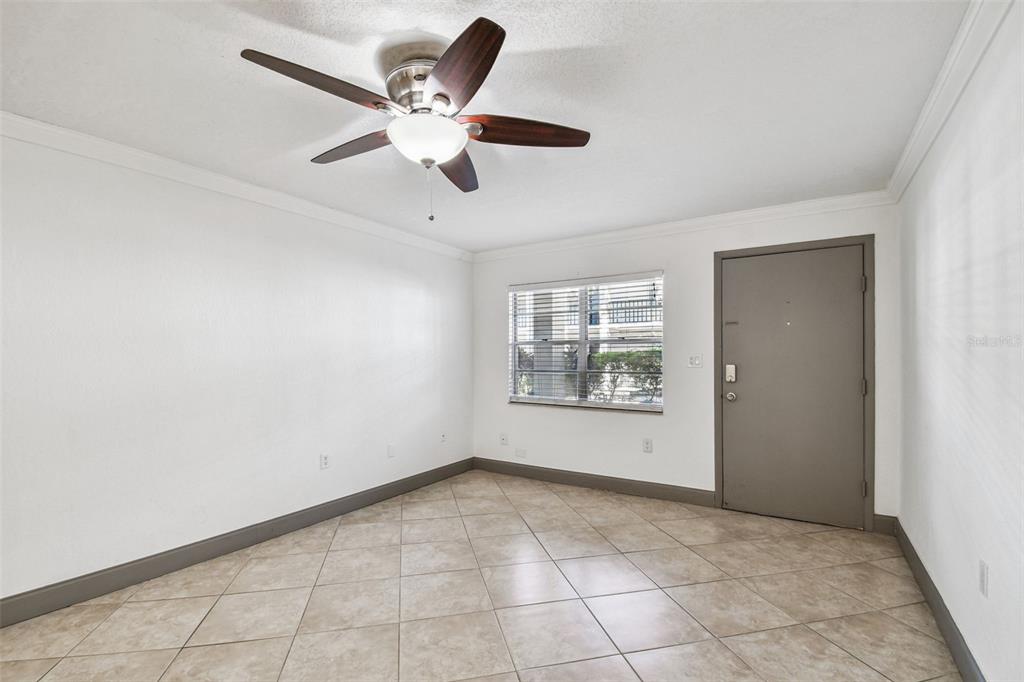 5221 Bayshore Boulevard, Unit 21 Tampa, FL 33611 - Photo 5 of 21 a view of an empty room with a window