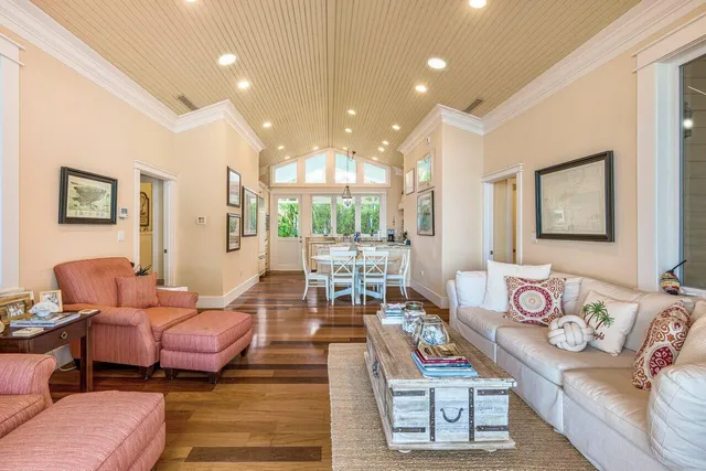 a spacious bedroom with two beds and a window