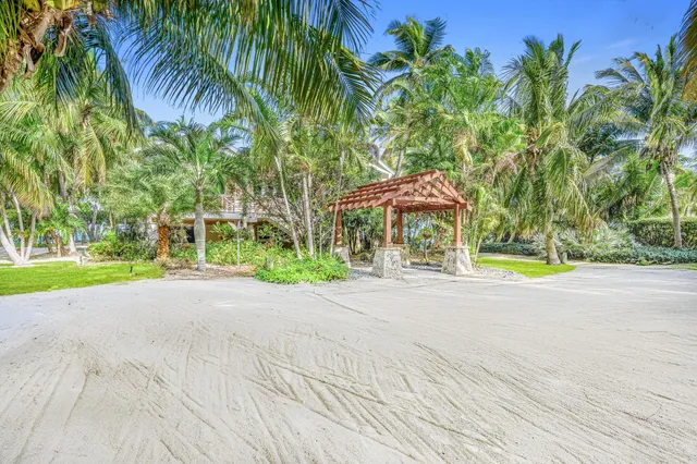 a view of house with swimming pool outdoor seating