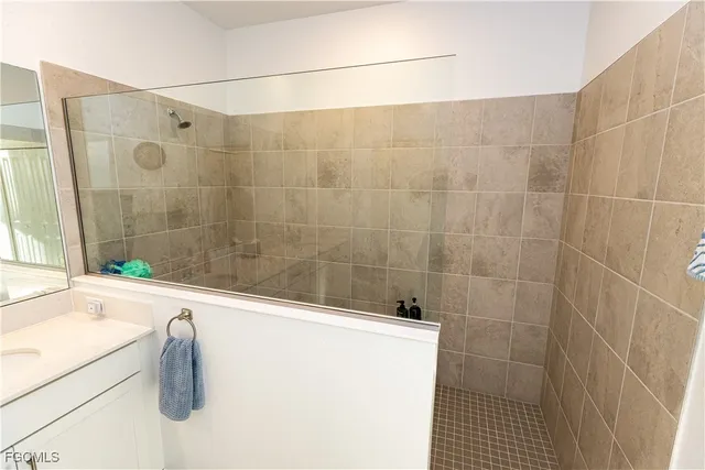 a bathroom with a shower and a sink