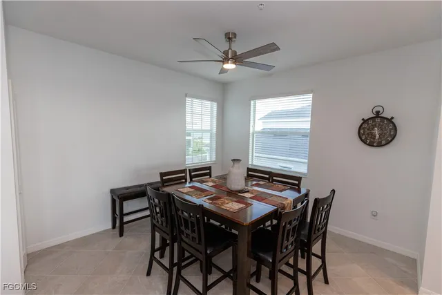 a view of a dining room with furniture and a chandelier