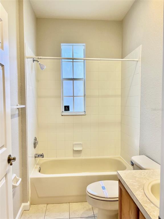 3341 Whitestone Circle, Unit 108 Kissimmee, FL 34741 - Photo 26 of 38 a bathroom with a sink a toilet and a bathtub