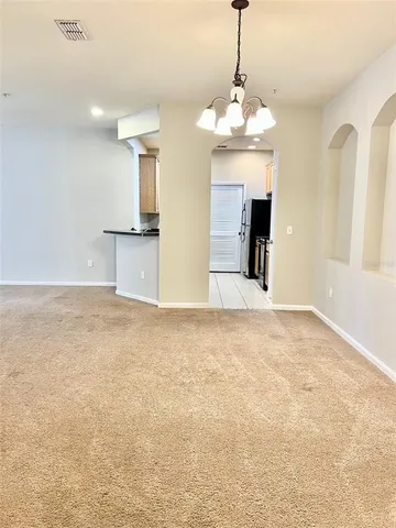 a view of a kitchen with microwave and cabinets