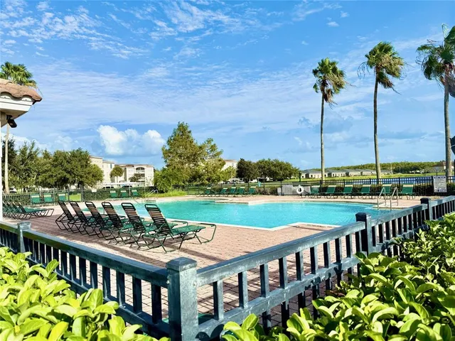 a front view of house with outdoor space and trees