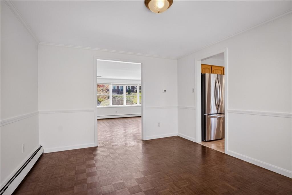 1768 Taper Drive Pittsburgh, PA 15241 - Photo 11 of 48 an empty room with wooden floor and windows