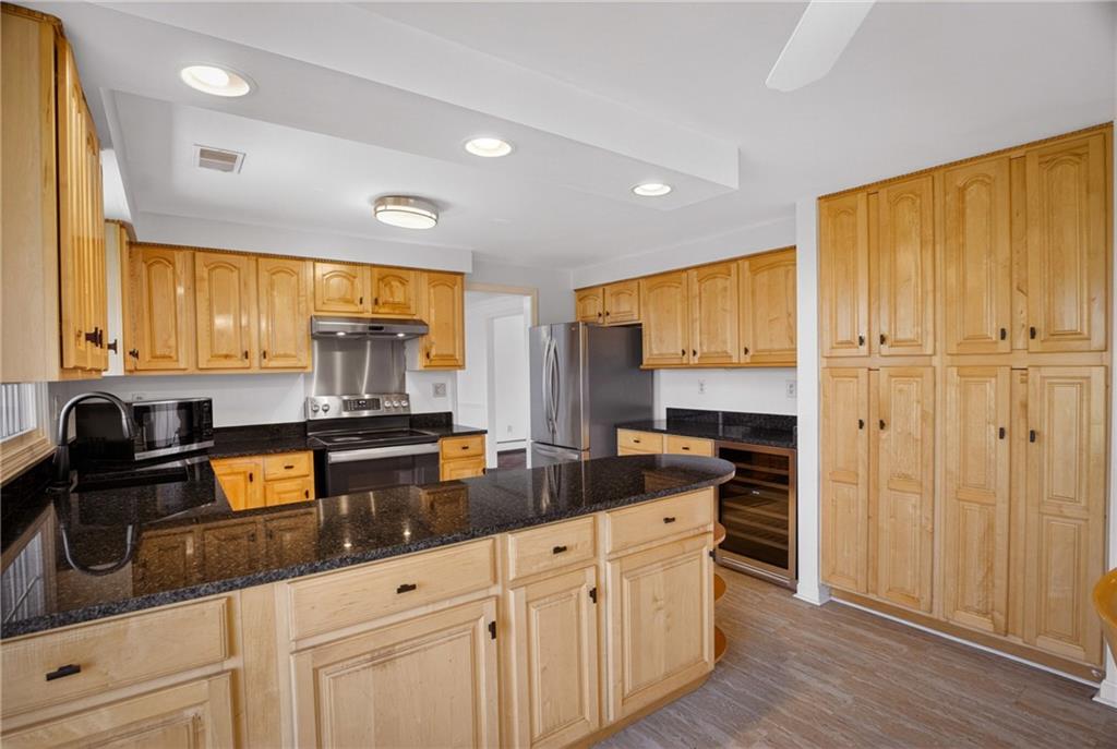 1768 Taper Drive Pittsburgh, PA 15241 - Photo 13 of 48 a kitchen with stainless steel appliances granite countertop a stove a sink and a refrigerator