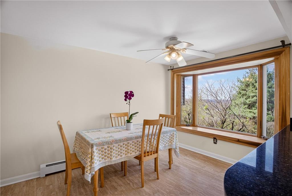 1768 Taper Drive Pittsburgh, PA 15241 - Photo 18 of 48 a dining room with furniture a chandelier and wooden floor