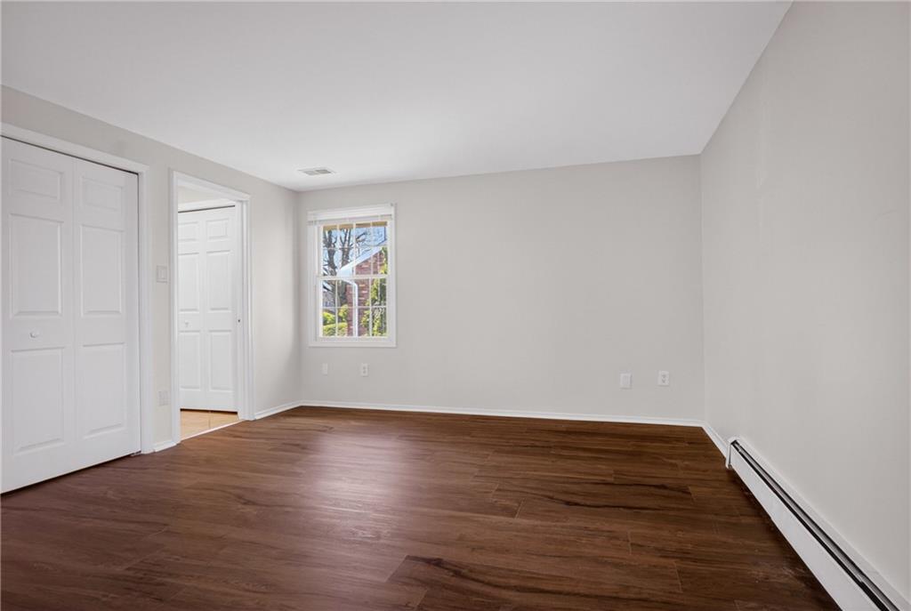 1768 Taper Drive Pittsburgh, PA 15241 - Photo 23 of 48 a view of an empty room with wooden floor and a window