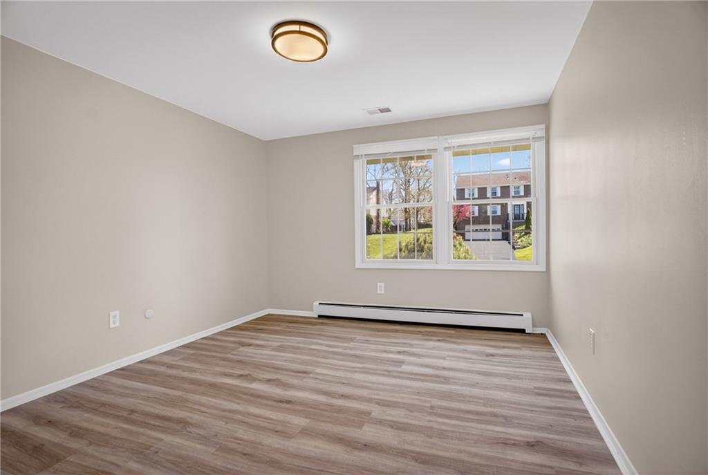 1768 Taper Drive Pittsburgh, PA 15241 - Photo 28 of 48 a view of an empty room with a window and wooden floor