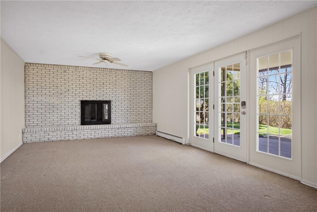 1768 Taper Drive Pittsburgh, PA 15241 - Photo 35 of 48 a view of an empty room with a fireplace and a window
