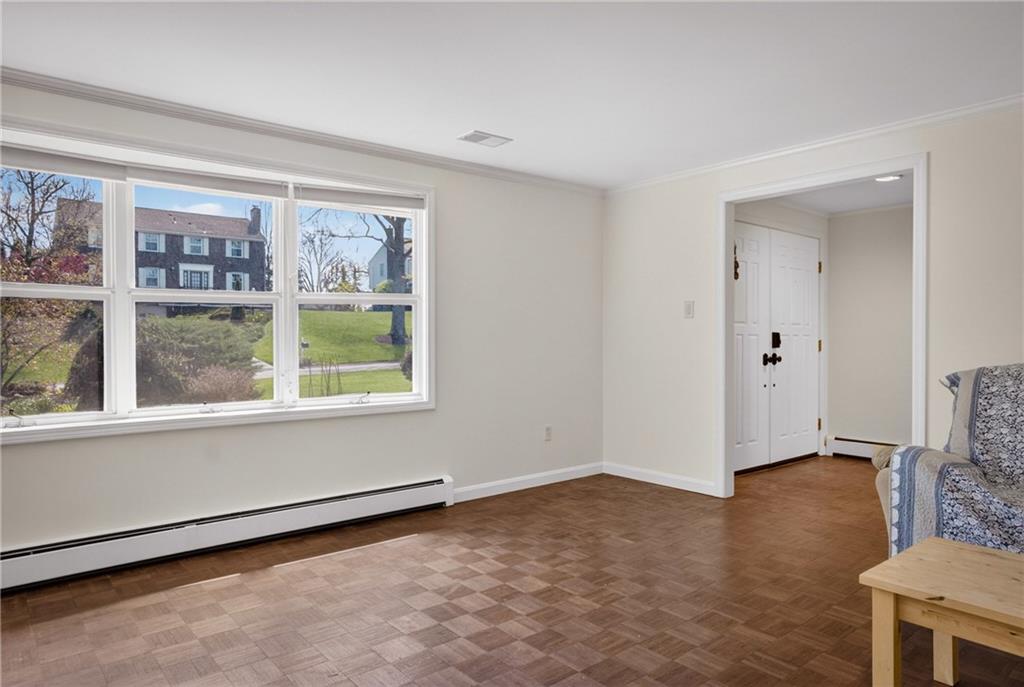 1768 Taper Drive Pittsburgh, PA 15241 - Photo 7 of 48 a view of an empty room with a window and wooden floor