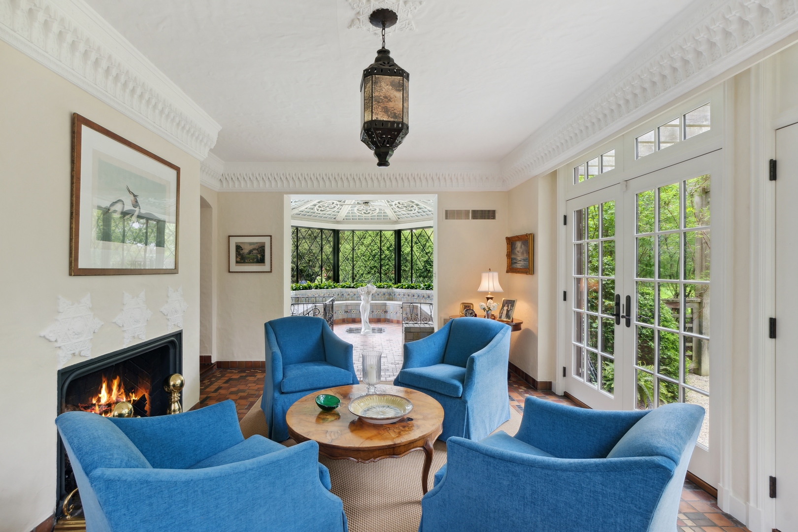 940 Private Road Winnetka, IL 60093 - Photo 20 of 68 a living room with furniture a fireplace and a large window