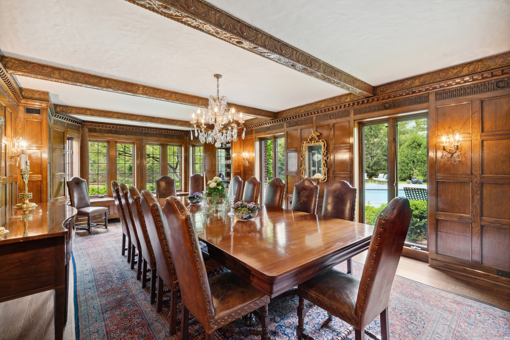 940 Private Road Winnetka, IL 60093 - Photo 23 of 68 a view of a dining room with furniture wooden floor and chandelier
