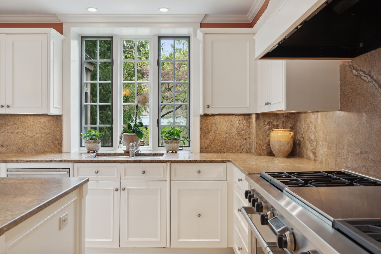 940 Private Road Winnetka, IL 60093 - Photo 28 of 68 a kitchen with granite countertop a sink and a stove