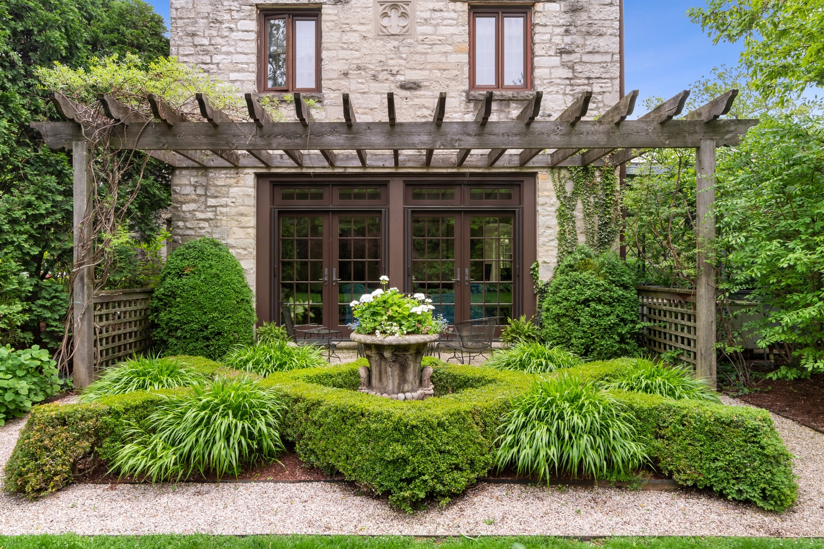 940 Private Road Winnetka, IL 60093 - Photo 3 of 68 a view of a house with fountain in front of it