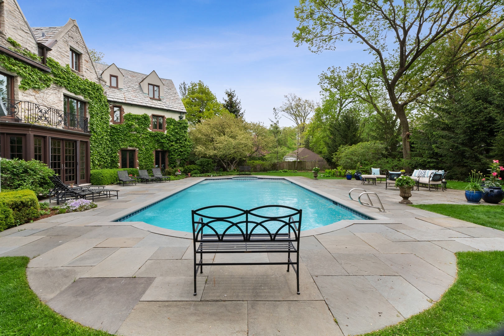 940 Private Road Winnetka, IL 60093 - Photo 5 of 68 a view of a swimming pool with lounge chair