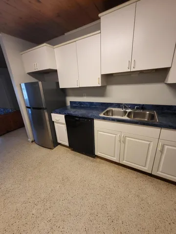 a bed room with furniture and a window