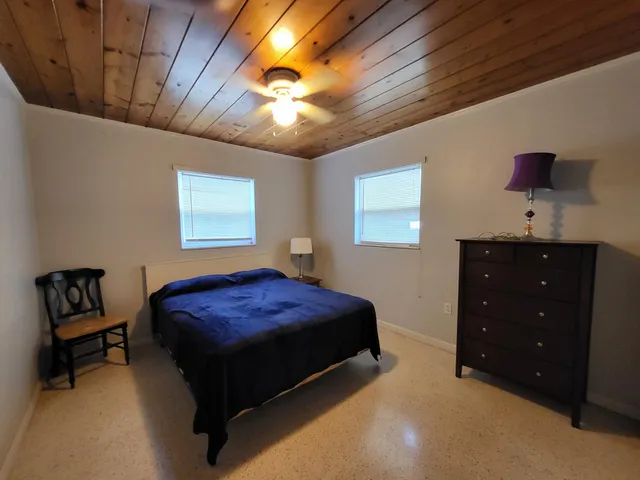 a bathroom with a sink toilet a mirror and shower