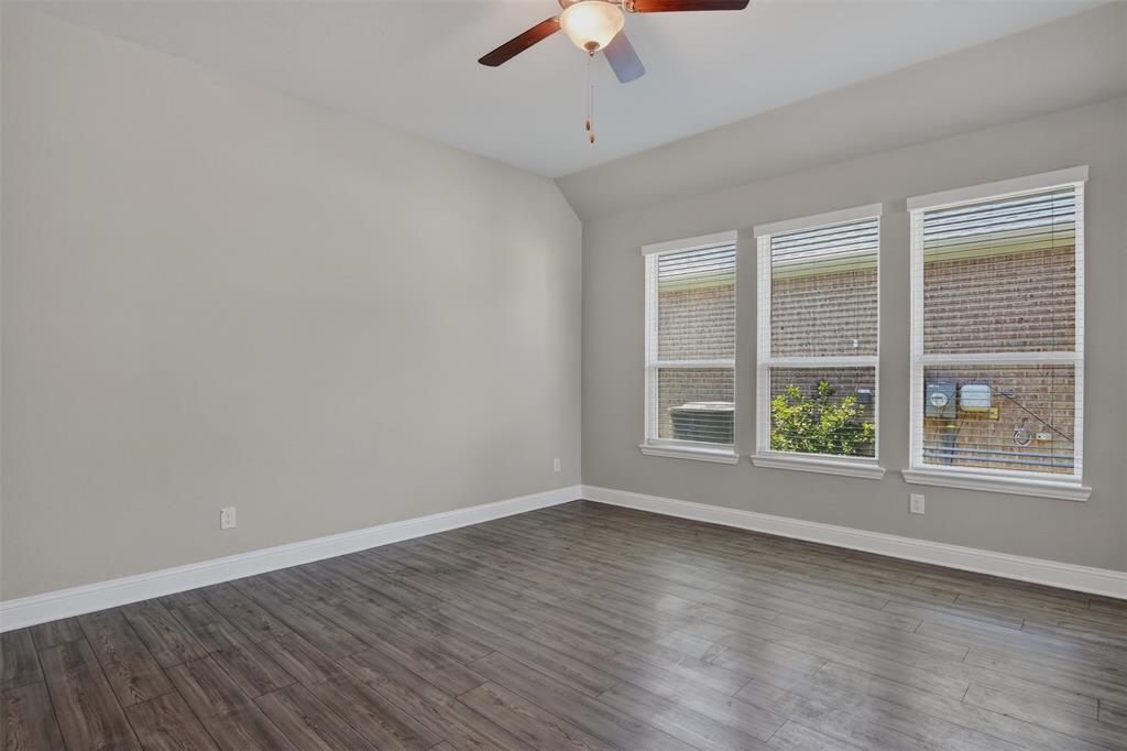 16812 Bitterroot Road Justin, TX 76247 - Photo 5 of 27 wooden floor in an empty room with a window