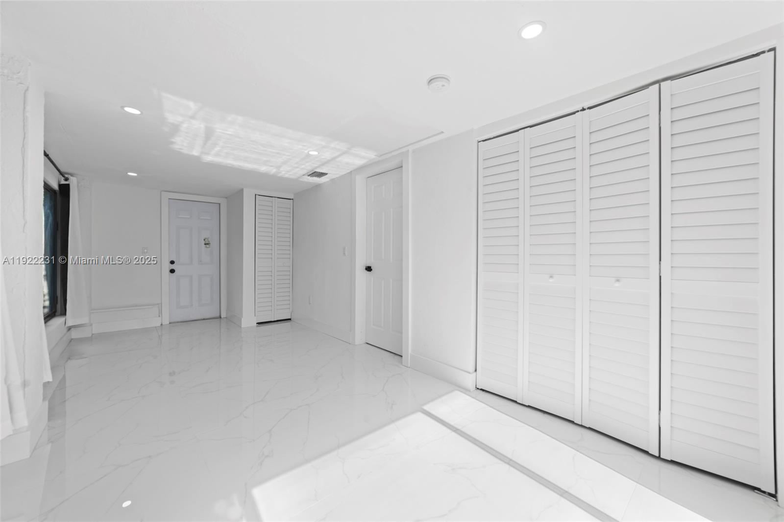 1671 Northeast 174th Street, Unit 1671 North Miami Beach, FL 33162 - Photo 12 of 21 a view of an empty room