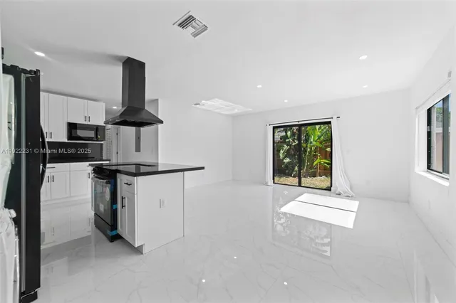 a kitchen with a sink and a window